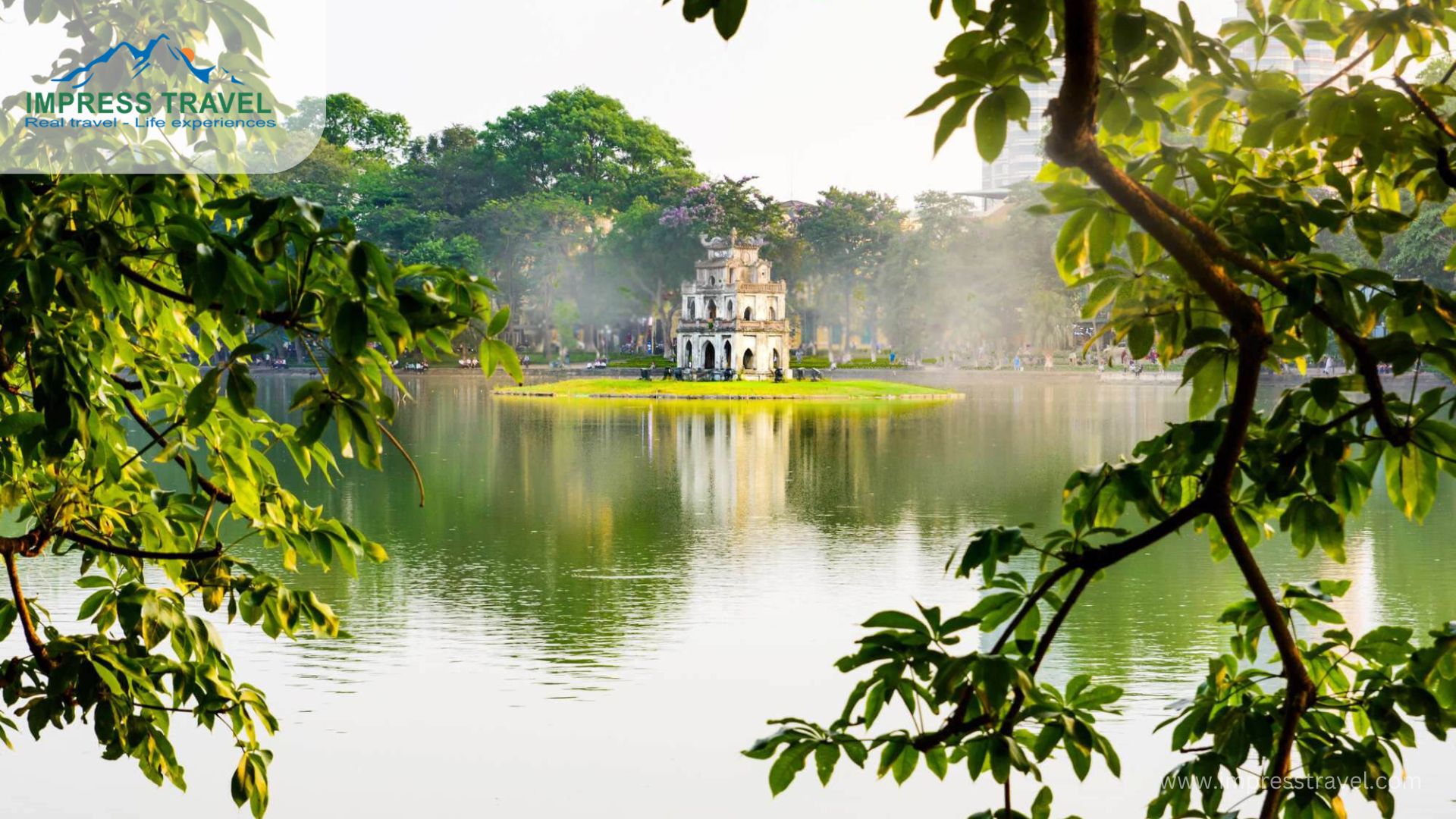 Hanoi location-The lake is adorned with the iconic red bridge leading to the Ngoc Son Temple, nestled on a small island. Visitors can enjoy leisurely walks around the lake, admire the scenic views, and learn about the legends surrounding the lake and its temple.