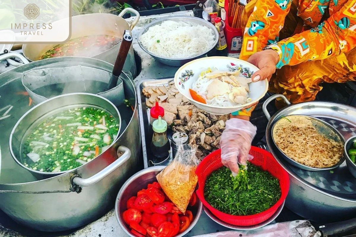 Enjoy noodle soup on the boat - Cai Rang Floating Market Tour in Can Tho