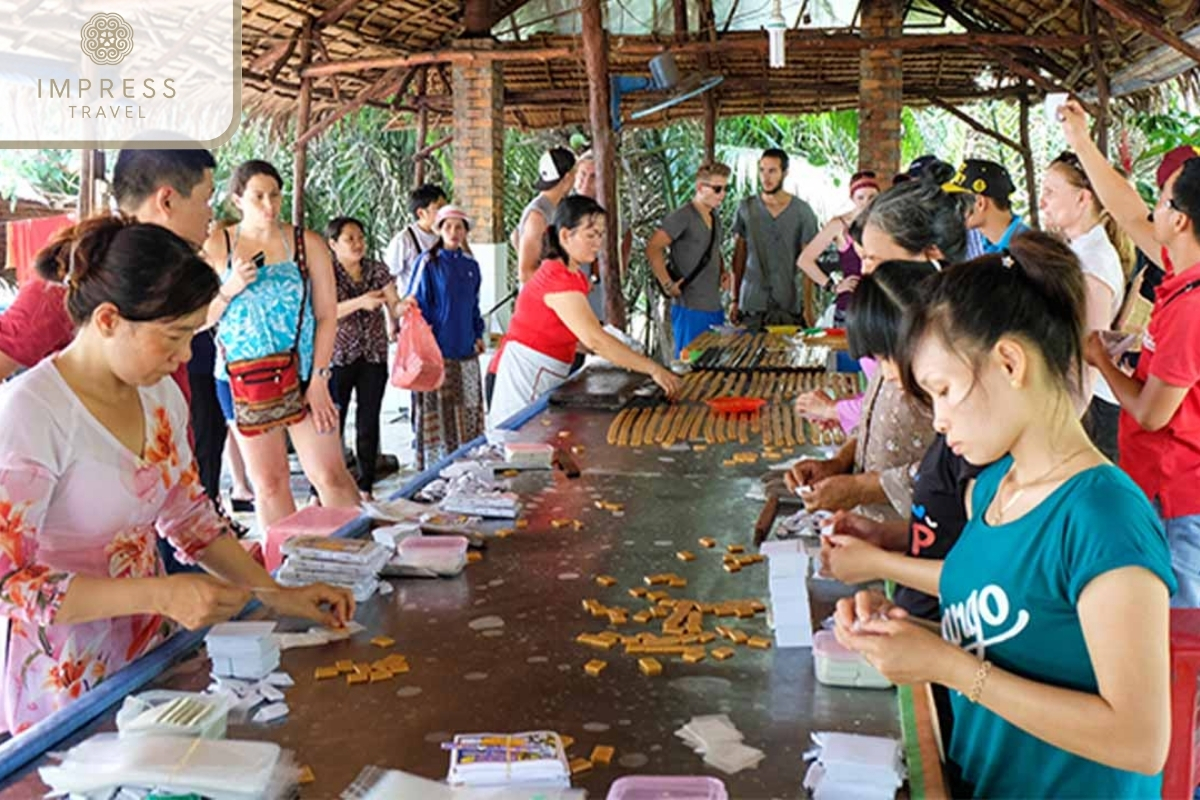 Coconut Candy Workshop in Con Thoi Son tour to explore Mekong River Delta