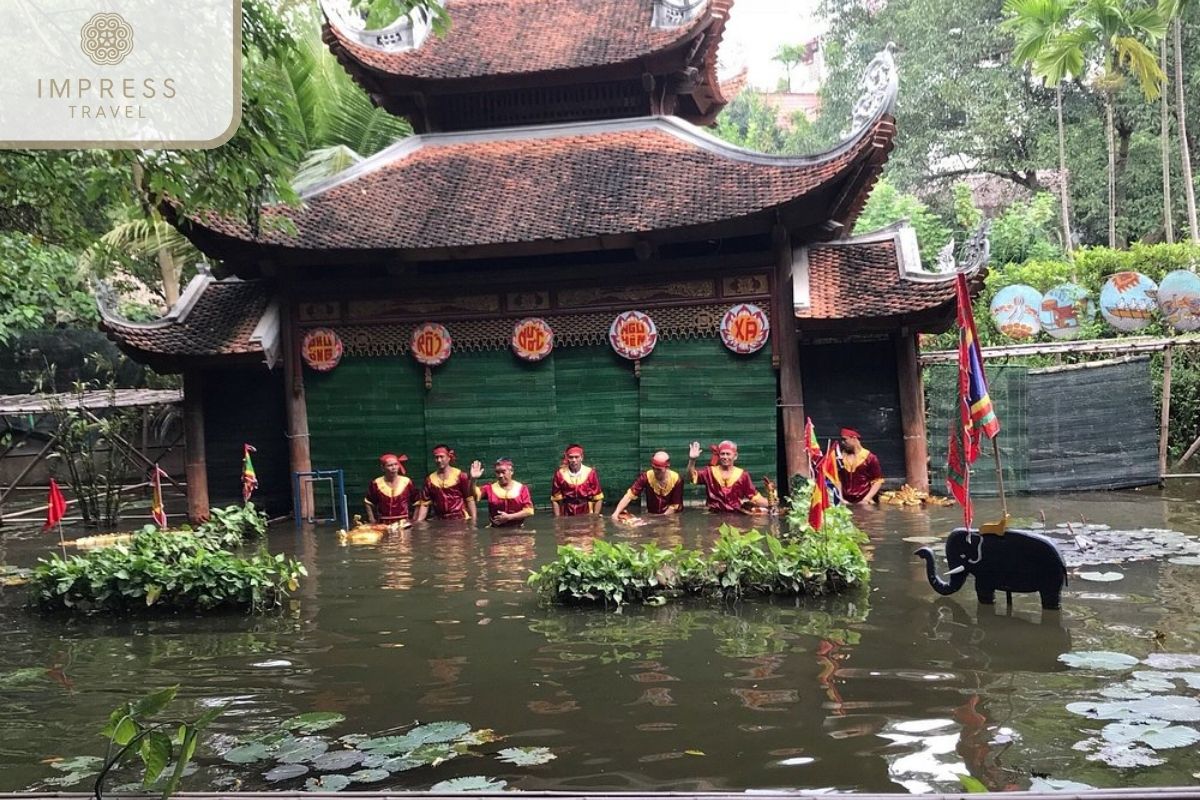 Water puppet artist in Hanoi Water Puppet Show tour