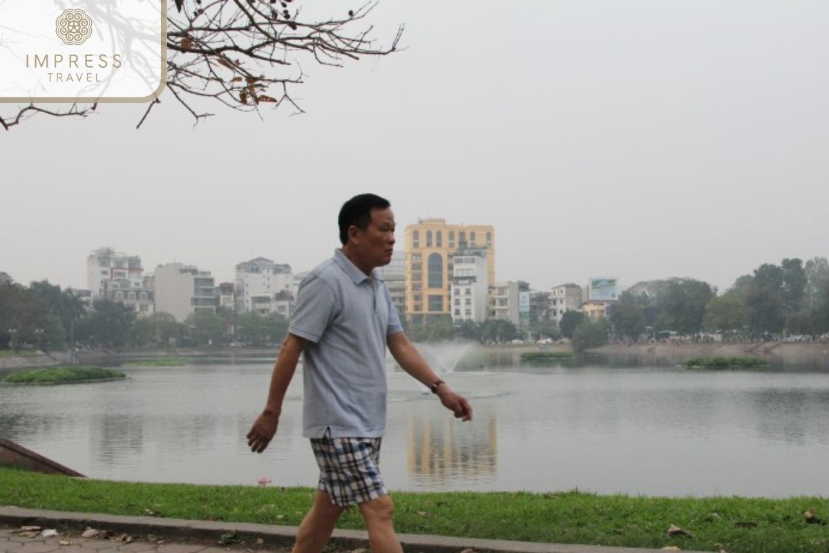 Exercise by the lake in Hanoi Morning Walking Tours