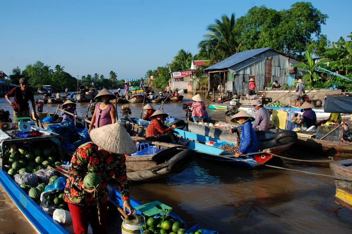 blending vibrant cityscapes with serene waterways, floating markets, and lush orchards in Southern Vietnam