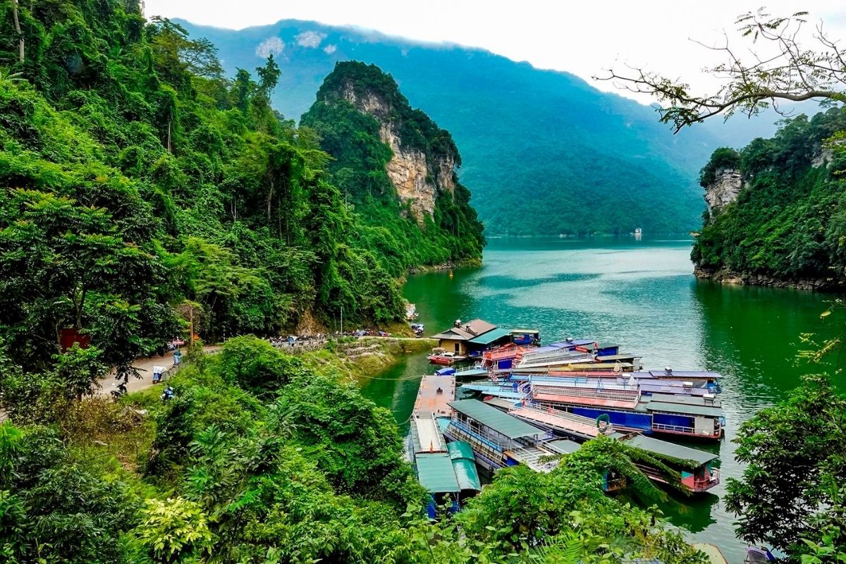 Ha Giang Tours take ride boat on Gam River with 4 days of trekking crossing rugged mountains