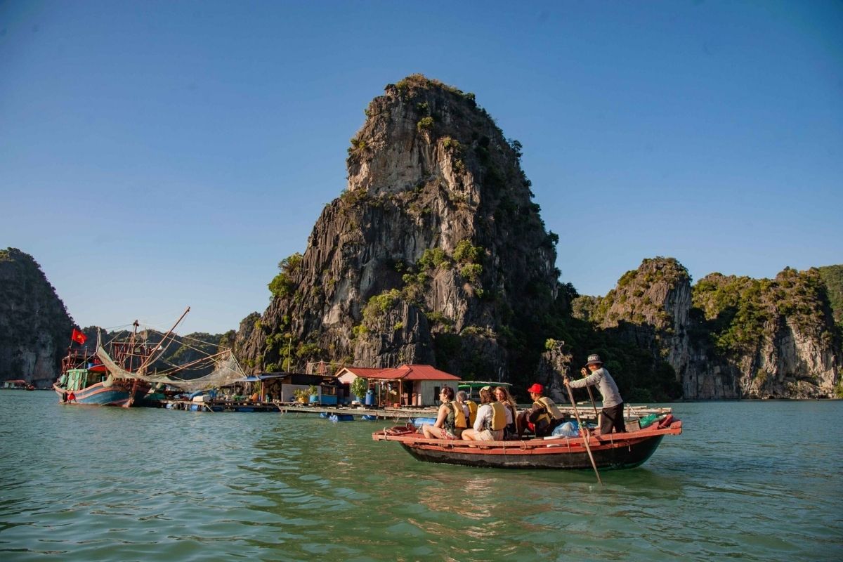 Take a traditional bamboo boat ride to Vung Vieng Village with Halong Tours Stay at Emperor Cruise