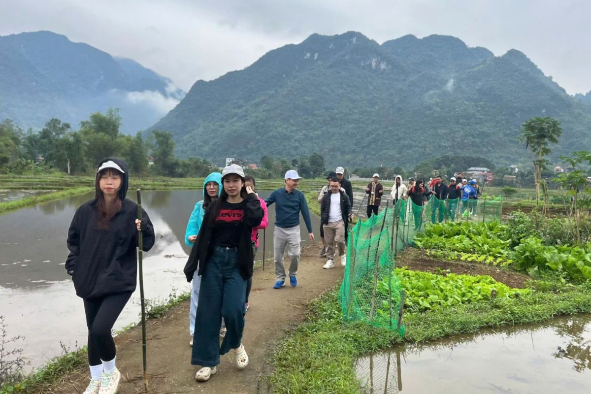 Wearing Poncho for the trip to Pu Luong Nature Reserve