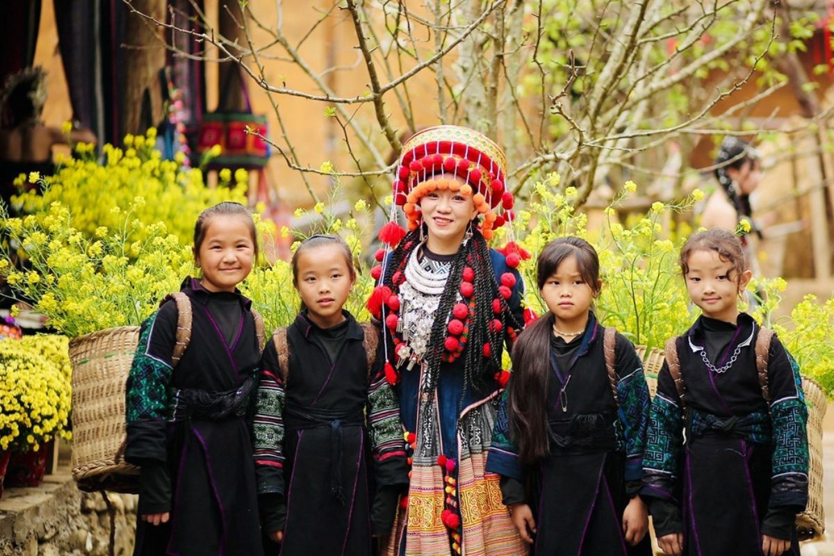 Taking photos with the locals in Cat Cat village.