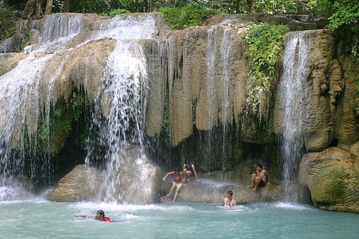 Swim at Erawan Waterfalls - Thailand land tour