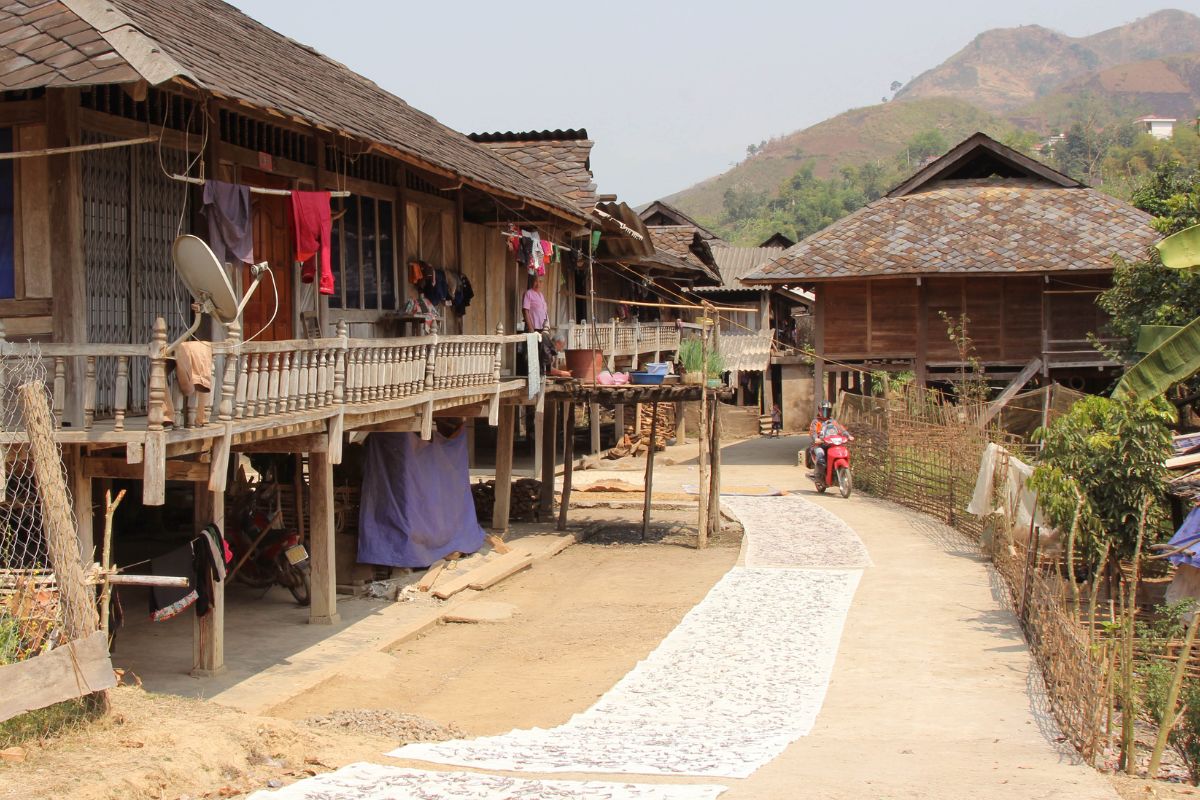 Passing through Thai villages on the Mai Chau to Sapa motorbike route.