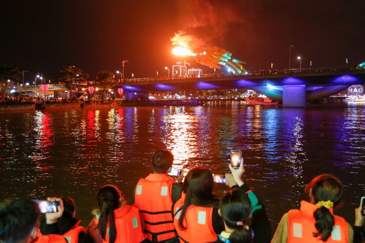 Watch Dragon Bridge Fire Show on Han River Cruise Da Nang