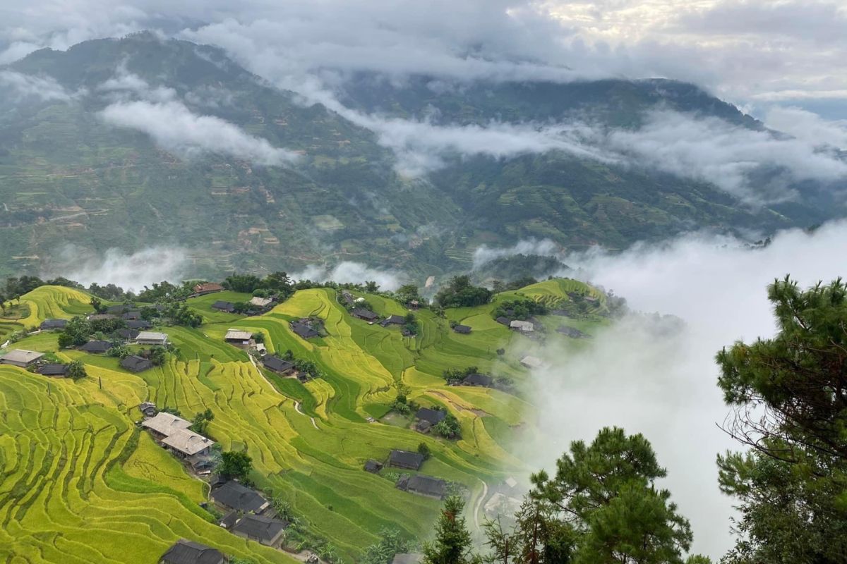 Thick clouds drifted beneath mountain peaks