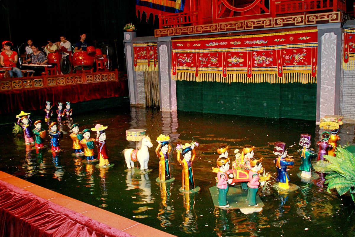 Watch the Water Puppet show at Thang Long Theater — a highlight of your 3-day Hanoi trip