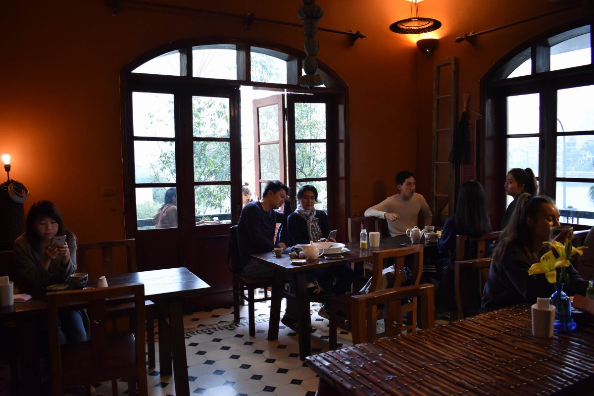 Relax at Maison de Tet — an Indochine garden café in your 3-day Hanoi trip